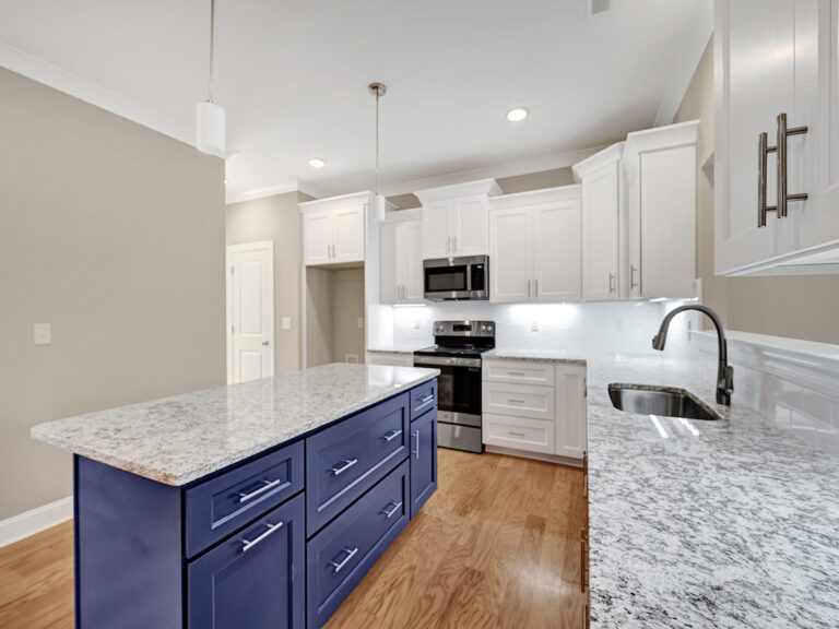 5445 Foxdale Drive, new listing by Dreambuilders WS. View of the kitchen island and cabinets.