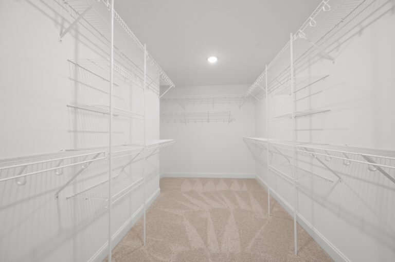 245 Painted Trails, Wynnfall Subdivision, photo of the primary bedroom walk in closet.
