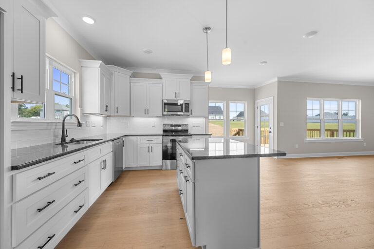 245 Painted Trails, Wynnfall Subdivision, photo of the open kitchen dining island set up.