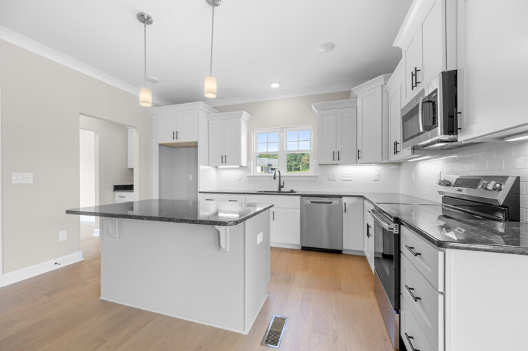 245 Painted Trails, Wynnfall Subdivision, photo of the kitchen and island.