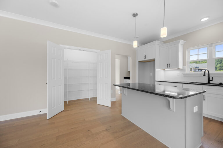 245 Painted Trails, Wynnfall Subdivision, photo of kitchen island and pantry.