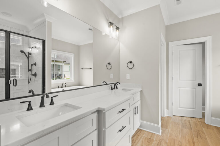 543 Barrett Road, photo of the primary bathroom with double vanities and walk in shower and garden tub.