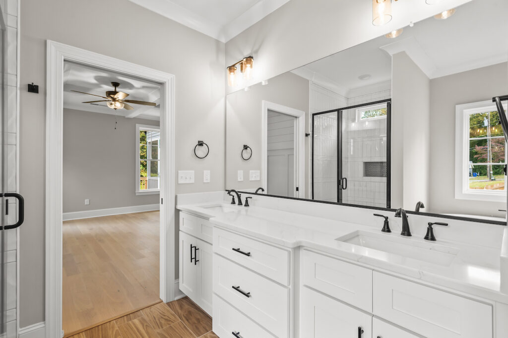 543 Barrett Road, photo of the primary bathroom with double vanities and lots of under cabinet space.