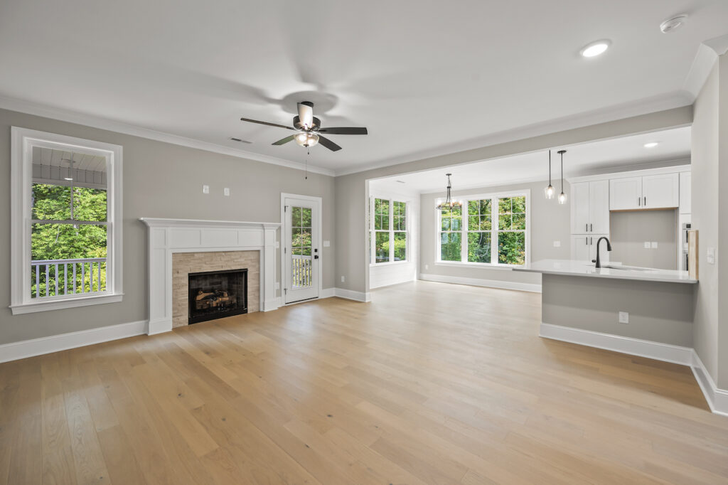 543 Barrett Road, photo of family living space, fireplace leading to the back deck or the dining area.
